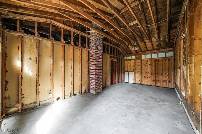 Breezeway featuring vaulted ceiling and concrete floors | Image 10