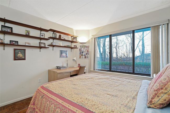 Bedroom featuring dark parquet flooring | Image 18