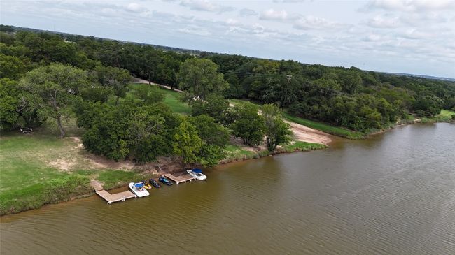 Bird's eye view of a large body of water and a forest | Image 22