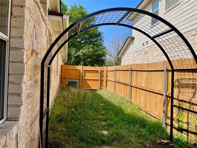 Metal arched arbor ready for vines or roses | Image 10
