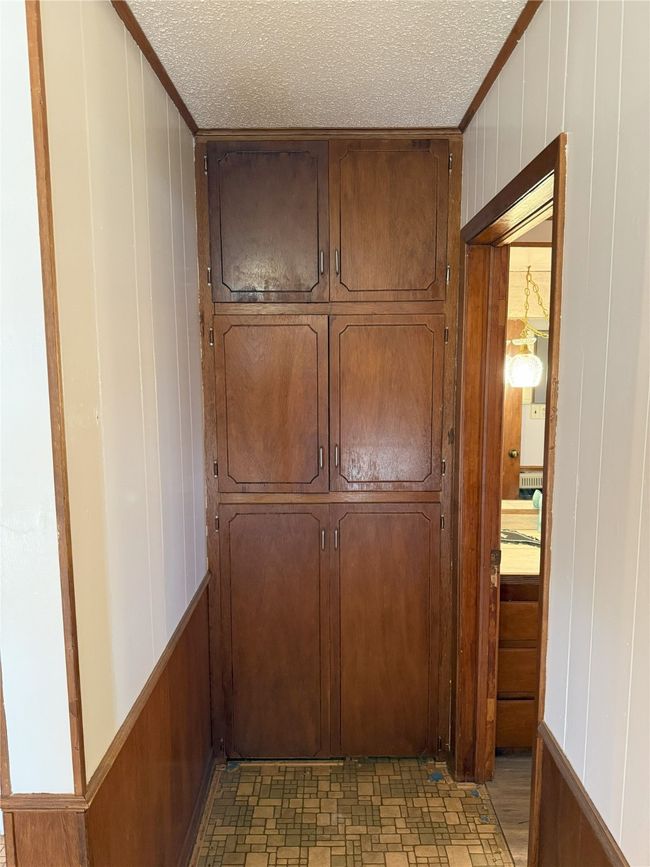 Hallway with built-in cabinets. | Image 15