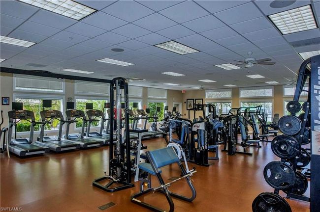Exercise room with a paneled ceiling and ceiling fan | Image 20