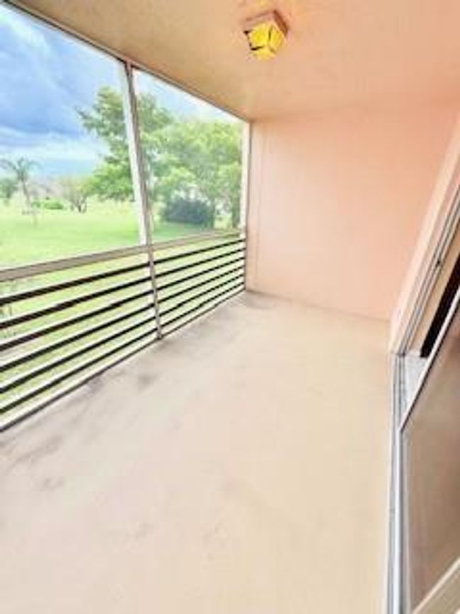 Screened patio overlooking golf course | Image 21