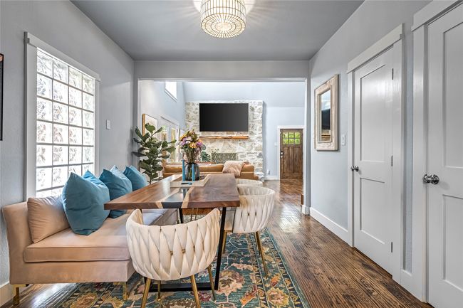Dining area featuring wood finished floors and baseboards | Image 12
