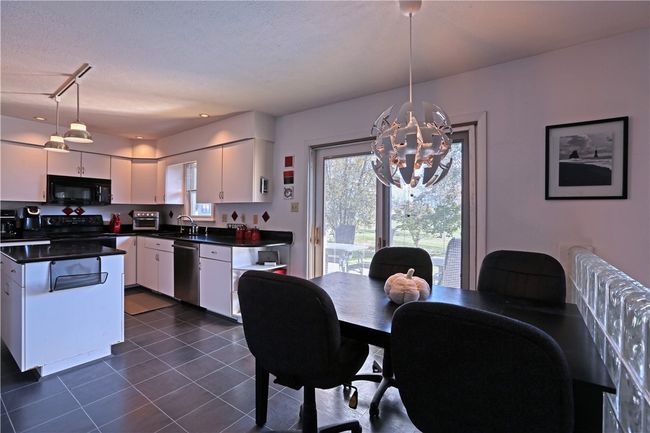 This eat-in kitchen is 10' X 20' with wonderful access to the deck and view of the back yard. | Image 7