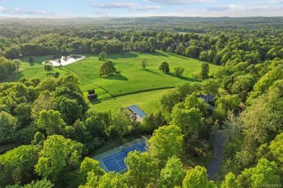 Tennis court, pool, entertaining pavilion and one of two ponds highlighted on the property. Subdivision possible; 2 acre zoning (RR) applies | Image 1