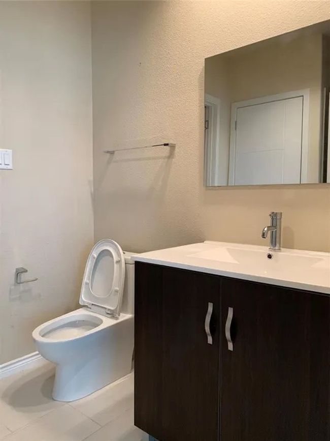 Half bathroom featuring vanity and tile patterned flooring | Image 23