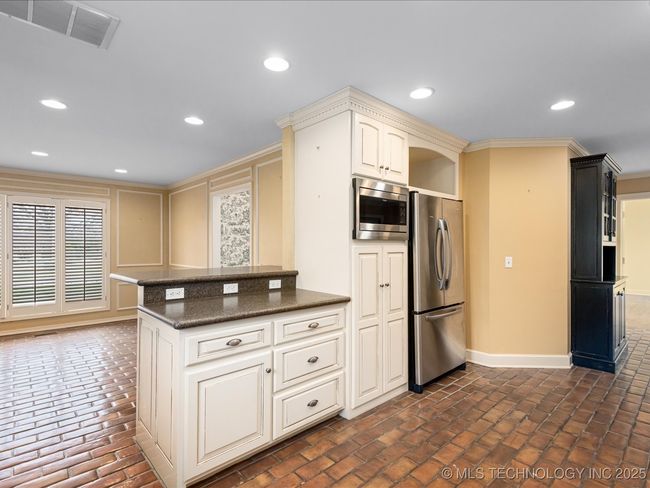 Gathering Room beyond and open to Kitchen | Image 17