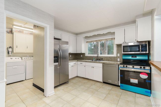 kitchen with new stainless steel appliances | Image 9