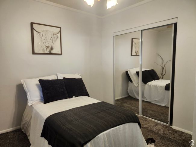 Primary Bedroom featuring carpet flooring, mirrored closet, and ceiling fan | Image 15