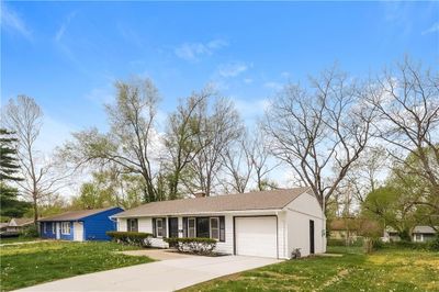 View of front facade featuring a garage and a front yard | Image 2