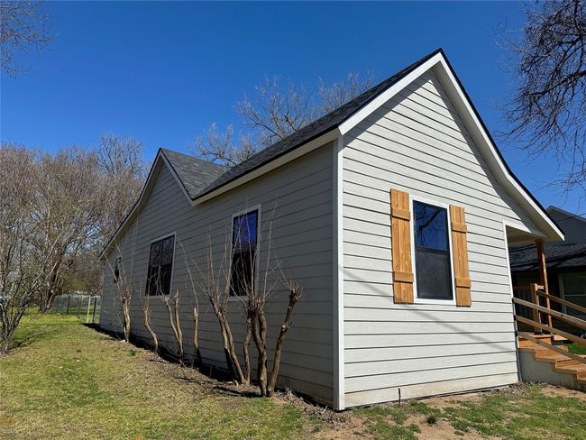 View of home's exterior featuring a lawn | Image 6