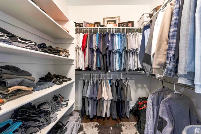 Spacious closet with wood finished floors | Image 27