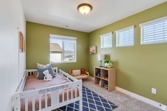 Carpeted bedroom featuring visible vents and baseboards | Image 16