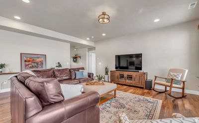 Living room with light wood-type flooring | Image 3