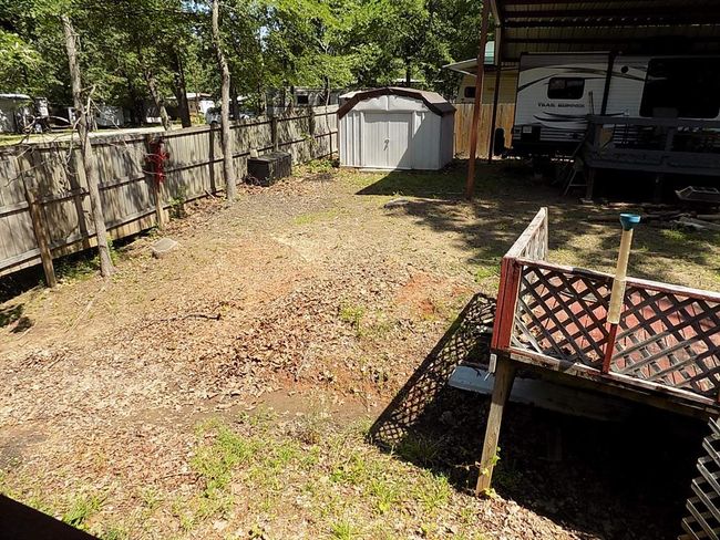 View of yard featuring a shed | Image 13