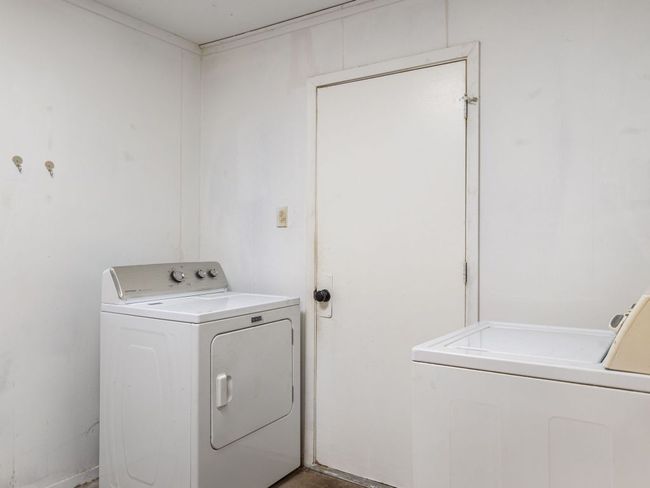 Washroom featuring washing machine and dryer | Image 18