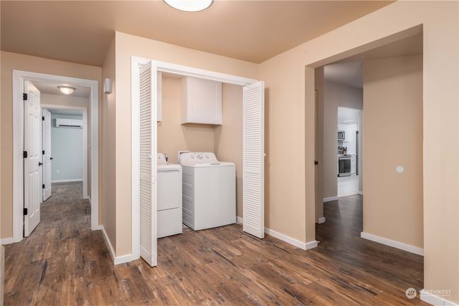 Laundry area and hallway that takes you to the kitchen on main level | Image 26