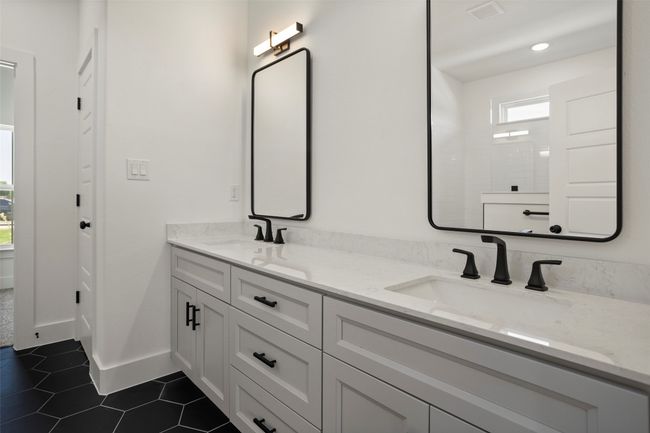 Bathroom featuring tile patterned flooring and dual bowl vanity | Image 12