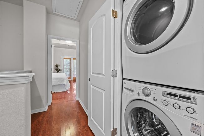 Stackable washer and dryer (included!) in the third floor closet at the top of the stairs. | Image 22