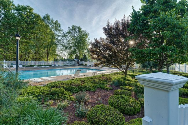 Landscaping around the pool gives a true oasis experience | Image 8