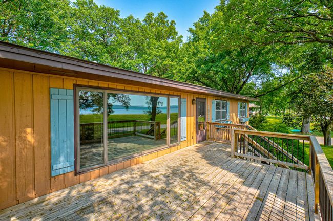 Step out onto your newer deck and take in the stunning St. Croix River views, with stairs leading right down to the beach just across the street! | Image 28