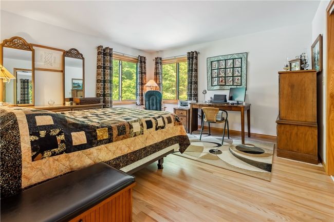 Main Level Bedroom with beautiful wood flooring | Image 22