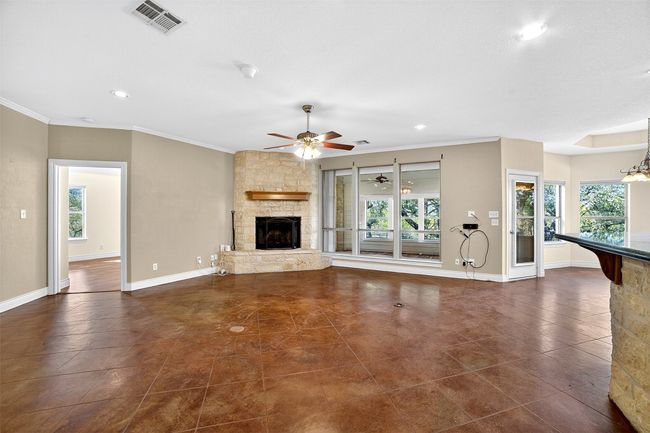 Living room with a wood burning fireplace | Image 7