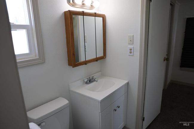 Half bathroom with vanity and toilet | Image 15