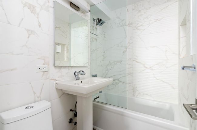 Full bath with tile walls and washtub / shower combination | Image 16