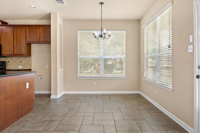 Enjoy the breakfast room right off the kitchen | Image 15