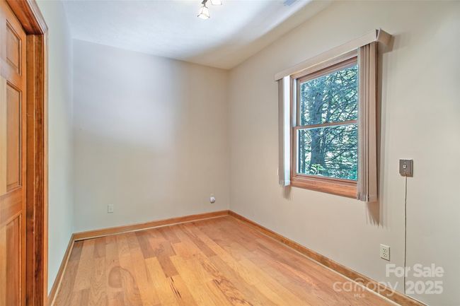 Use this room as an office, sewing room, or just for additional storage. Accesses the garage | Image 25
