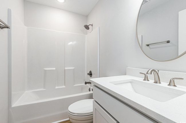 Full bathroom with vanity, bathing tub / shower combination, and recessed lighting | Image 23