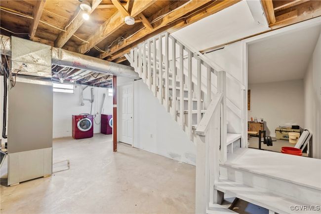 Basement featuring washing machine and dryer and stairway | Image 30