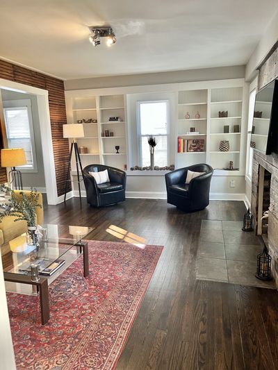 Built-in bookshelves line the far wall. | Image 3