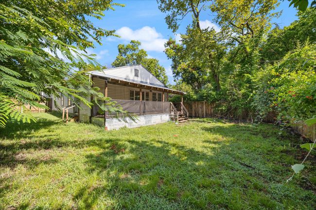 View of fenced backyard | Image 21