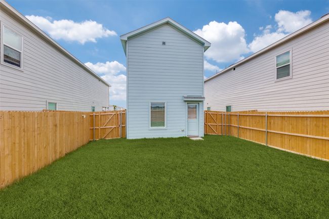 Back of house featuring a fenced backyard | Image 12