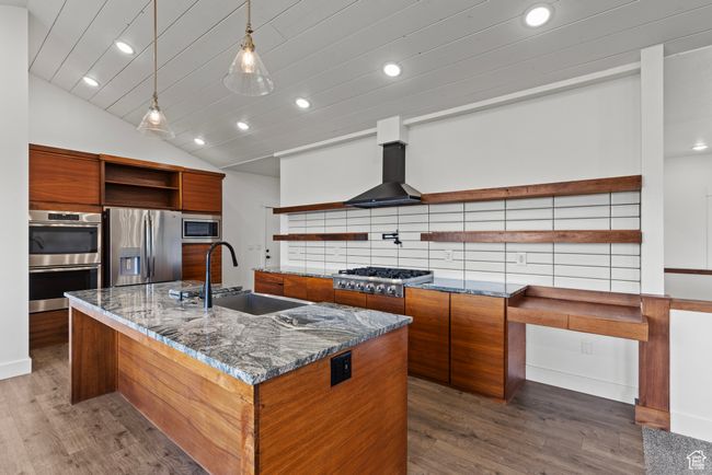 Kitchen featuring open shelves, appliances with stainless steel finishes, a sink, brown cabinets, and recessed lighting | Image 5