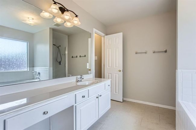 Primary bathroom with brand new flooring. | Image 27