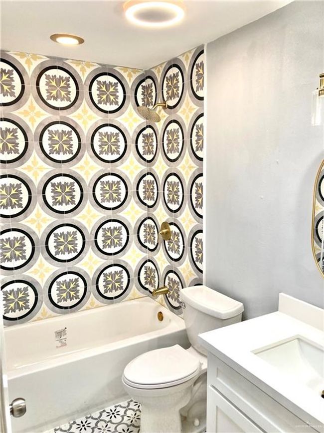Bathroom with vanity, shower combination, and tile patterned flooring | Image 21