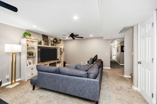 Downstairs living room featuring recessed lighting, carpet, baseboards, and ceiling fan | Image 25