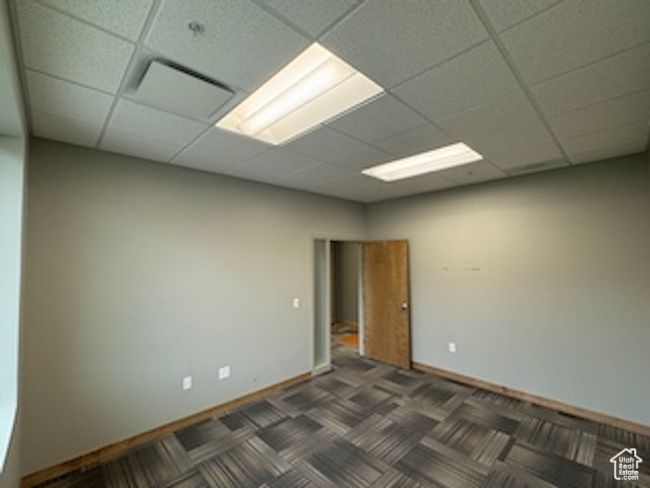 Unfurnished room featuring a paneled ceiling | Image 31