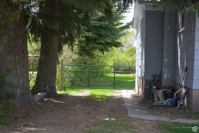 View of yard with a gate | Image 31