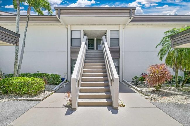 Entrance to property featuring stucco siding | Image 16