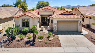 This gorgeous home is located on a south-facing greenbelt with mountain views in the active adult resort community of Arizona Traditions. | Image 1