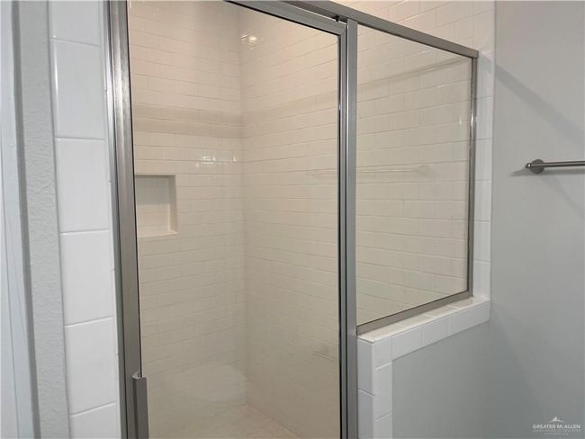 Bathroom featuring a shower stall | Image 12