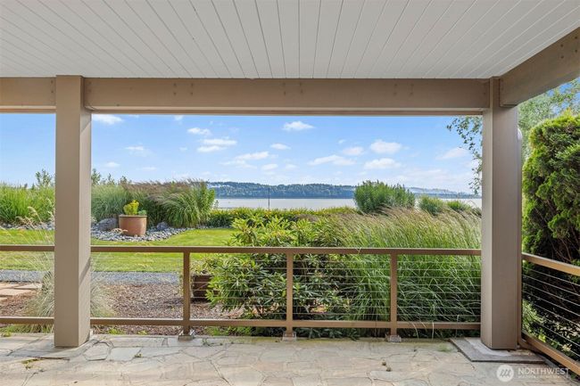 Covered patio area off primary bedroom. Amazing views. | Image 15