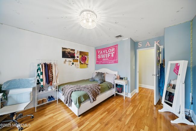Bedroom #3, large windows, hardwood floors & custom closets! | Image 29