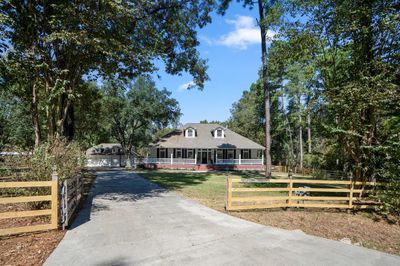 Charming two-story home located at the end of a cul-de-sac on 4.64 acres, surrounded by mature trees. | Image 2