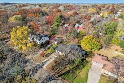 Prime walkability to Community center/ library & shopping.Drone photo showing nice wooded lot. | Image 1